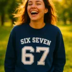 six seven meme 67 longsleeve sweatshirt worn by a lifestyle girl smiling in the park.